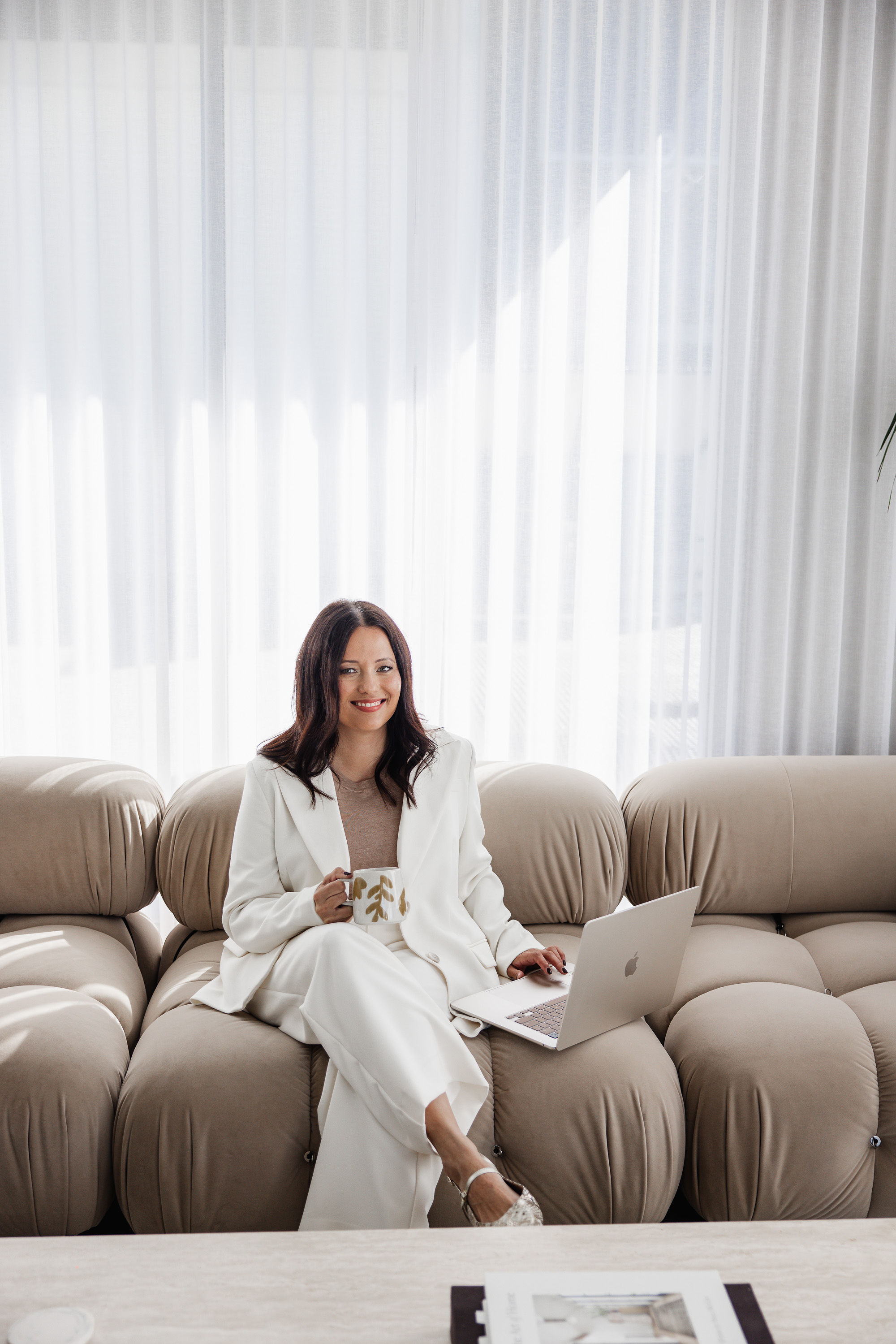 Karen, mortgage broker at Kaleo Finance, seated with a laptop